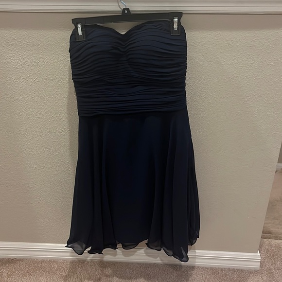 A dark blue strapless dress. It is simple and super cute! - Picture 1 of 3